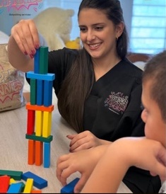 A Super Nannies caregiver playing with a child