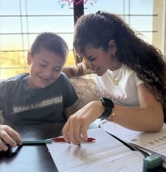 A Super Nannies tutor helping a child learn